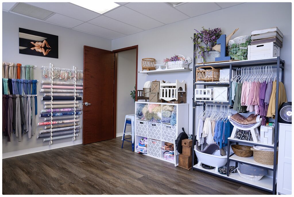 Baby outfits and props selection for a newborn photography session in West Palm Beach, FL.